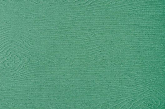 Dark green paper textured background.
