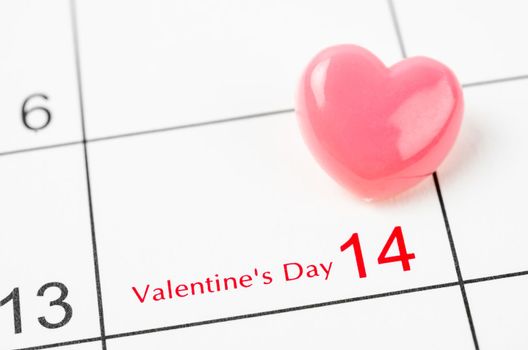 Blank 14 February Valentine's Day Calendar with pink heart push pin.