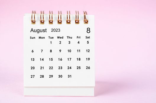 August 2023 desk calendar for 2023 year on pink color background.