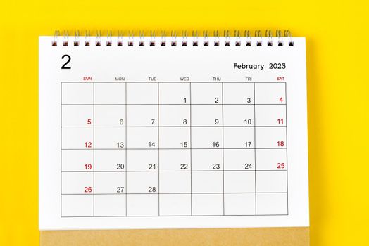 February 2023 Monthly desk calendar for 2023 year on yellow background.