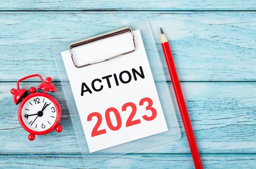 2023 Action; Goal and Target Setting List for 2023 year with alarm clock. Change and determination concept.