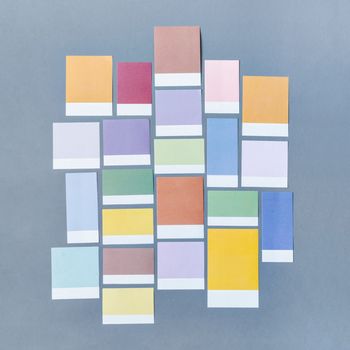 Colorful blank notes adhesives paper for your text or message on grey background.