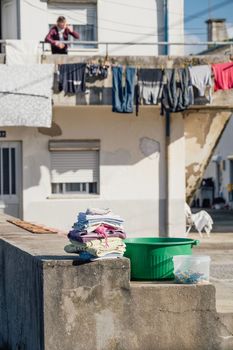 folded clothes in street after getting dried on a bright and sunny afternoon in Espinho , Portugal.