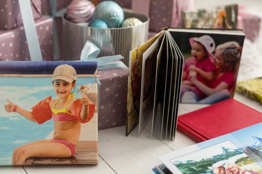 a photo album near the Christmas tree as a gift