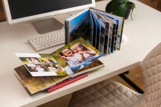 Family photos archive saved in brightly designed photo book, bright summer memories placed in the photobook.