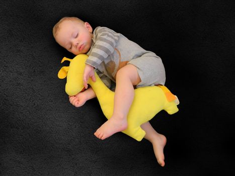 Cute little kid sleeping. Little boy sleeping in bed Cute little boy sleeping, tired child taking a nap in his small bed, clean, fresh and cozy bedding sheets, bedtime for kids. High quality photo