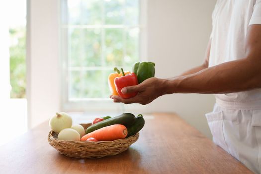 Portrait of beautiful young asian woman making salad at home. cooking food and Lifestyle moment.