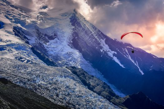 Paragliding above Mont Blanc massif idyllic alpine landscape , Chamonix, French Alps