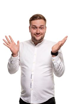 Thrilled excited and over-emotive attractive happy guy smiling broadly gasping and screaming from joy and happiness gesturing with palms clapping hands from surprise and rejoice. Studio portrait on white background