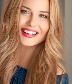 Beauty and femininity, beautiful blonde woman with long blond hair smiling, natural portrait closeup