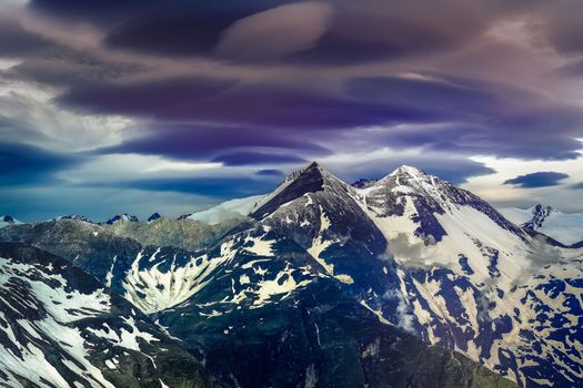 Austrian alps in Grossglockner National Park, snowcapped alps at dawn dramatic sky, Austria