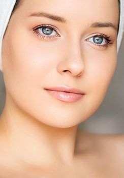 Skin care and beauty routine, beautiful woman with white towel wrapped around head, skincare cosmetics and face cosmetology, close-up portrait