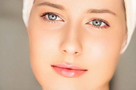 Skin care and beauty routine, beautiful woman with white towel wrapped around head, skincare cosmetics and face cosmetology, close-up portrait