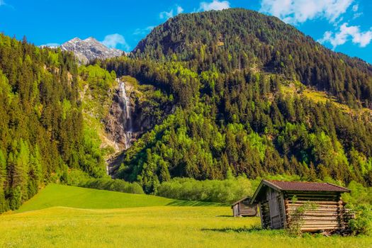 Alpine farm in Green Stubai valley near Innsbruck at sunset, Tyrol, Austria