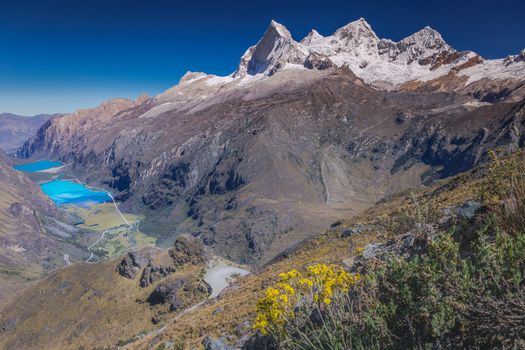 Turquoise Llanganuco lake in Cordillera Blanca at sunny day, snowcapped Andes, Ancash, Peru