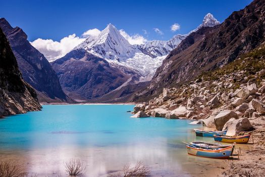 Turquoise Paron laguna in Cordillera Blanca at sunny day, snowcapped Andes, Ancash, Peru