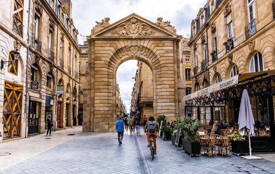 Bordeaux, France - 28 August 2022: Old gate arch on a street in the center of Bordeaux