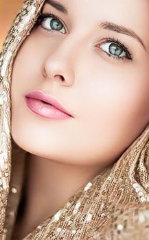 Beauty, luxury fashion and glamour, woman dressed in gold, portrait