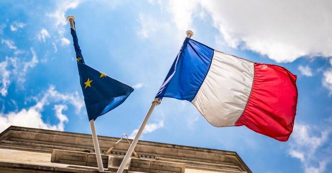 France flag and twisted European Union flag on a sky background.