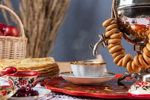 Pancakes with berries and sour cream on the table. Shrovetide Maslenitsa festival concept.