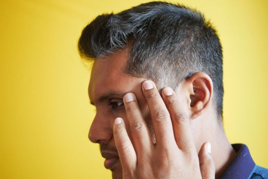 hair loss concept with man checking his hair .