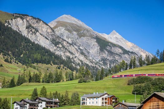Train and Preda village in the Swiss Alps at sunny day, Switzerland