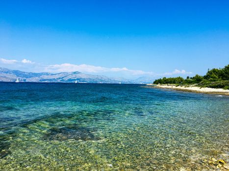 Brac Island Croatia in the middle of summer. With boats and people enjoying summer in the sandy bay. . High quality photo