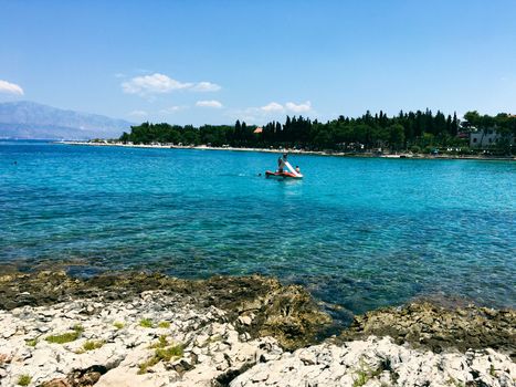 Brac Island Croatia in the middle of summer. With boats and people enjoying summer in the sandy bay. . High quality photo