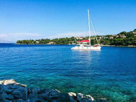 Brac Island Croatia in the middle of summer. With boats and people enjoying summer in the sandy bay. . High quality photo