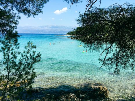 Brac Island Croatia in the middle of summer. With boats and people enjoying summer in the sandy bay. . High quality photo