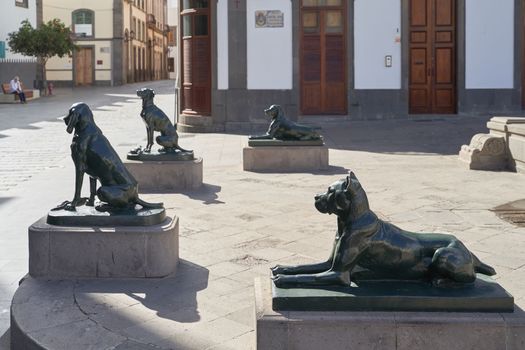 Las Palmas de Gran Canaria, Spain - September 18, 2022: Iron canarian dogs statues on Plaza Santa Ana, modelled after the Canarian hounds that were originally on the island when the Spanish settled.