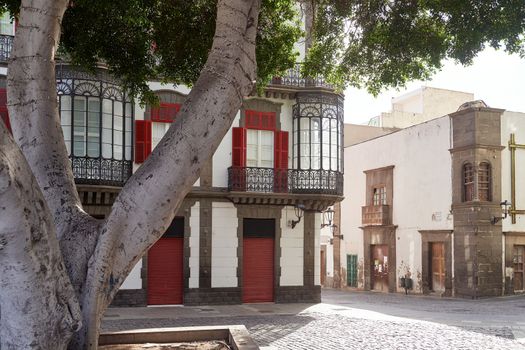 Beautiful old building with red elements and glass oriel window in hisotrical part of Las Palmas, Canary Islands