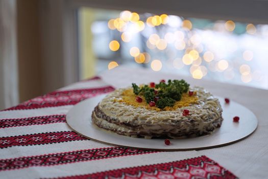 Traditional Ukrainian food on the table with embroidered tablecloth.