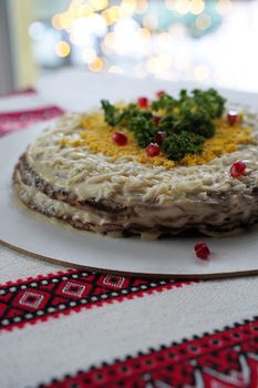 Traditional Ukrainian food on the table with embroidered tablecloth.