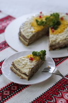 Traditional Ukrainian food on the table with embroidered tablecloth.