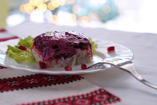 Traditional Ukrainian food on the table with embroidered tablecloth.