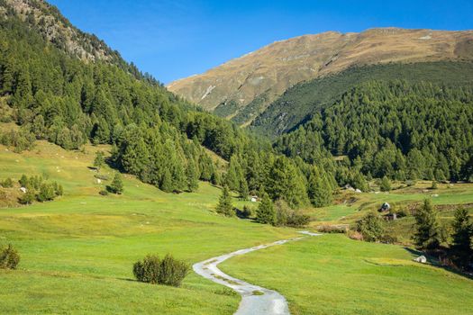 Mountain road in Engadine, country road with swiss alps, Switzerland at sunny day