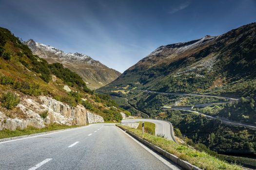 Grimsel and Furka mountain pass, dramatic road with swiss alps at sunny day, Switzerland