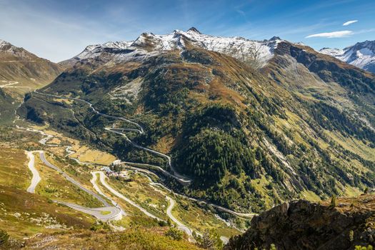 Grimsel and Furka mountain pass, dramatic road with swiss alps at sunny day, Switzerland