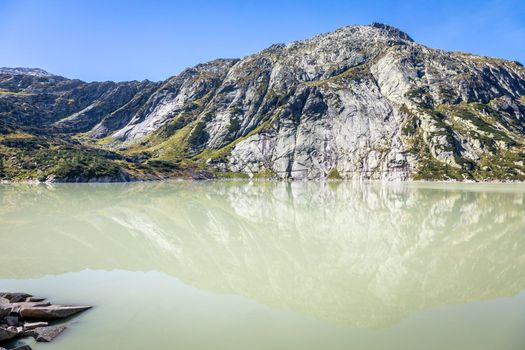 Alpine Lake at Oberalp Pass in Graubunden swiss alps, Grisons, Switzerland