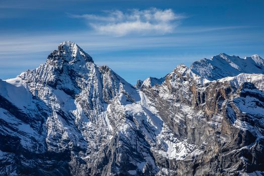 Top of the Schilthorn and view of Snowcapped Bernese Swiss alps, panorama of Eiger, Monch and Jungfrau, Switzerland
