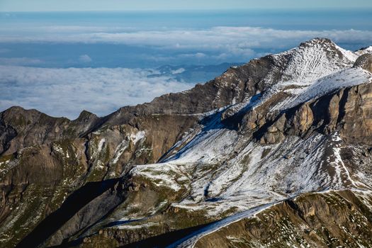 Top of the Schilthorn and view of Snowcapped Bernese Swiss alps, panorama of Eiger, Monch and Jungfrau, Switzerland