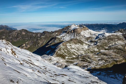 Top of the Schilthorn and view of Snowcapped Bernese Swiss alps, panorama of Eiger, Monch and Jungfrau, Switzerland