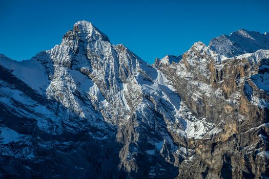 Top of the Schilthorn and view of Snowcapped Bernese Swiss alps, panorama of Eiger, Monch and Jungfrau, Switzerland