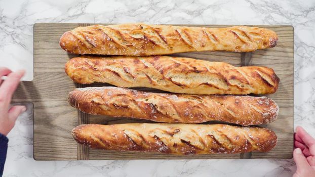 Flat lay. Freshly baked homemade French baguette bread.