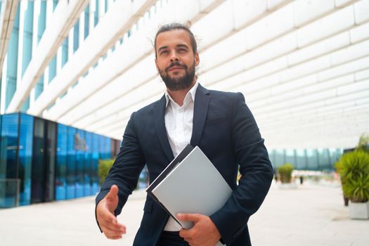 Business. Businessman Giving Hand For Handshake Welcome Gesture Adult Hispanic Male Business Person Holding Document Paper Give Hand Ready Handshake Office Building Background