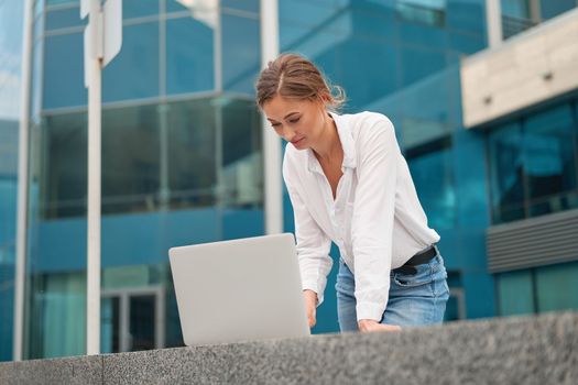 Businesswoman laptop successful woman business person outdoor corporate building exterior Pensive elegance caucasian professional business woman middle age ecommerce deal Online banking