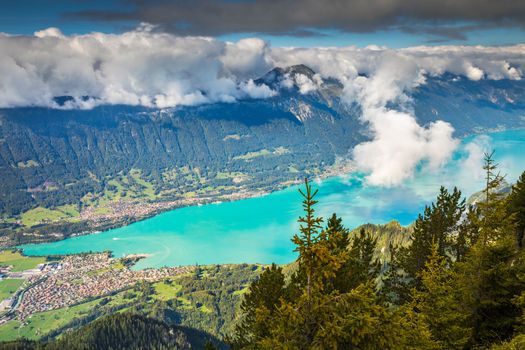 Aerial view of Swiss Alps and Lake Brienz at dramatic sunset, Interlaken, Switzerland
