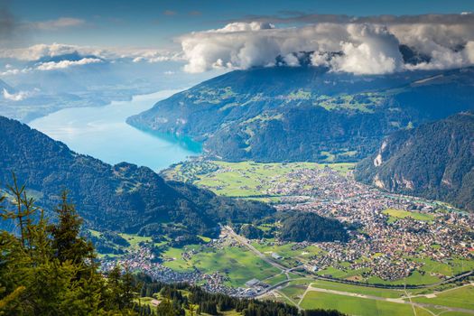 Aerial view of Swiss Alps and Lake Thun at dramatic sunset, Interlaken, Switzerland