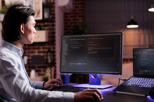 Asian coder programming server encryption on firewall software, using security network interface to code system data for app development. Working with binary code text to script program.
